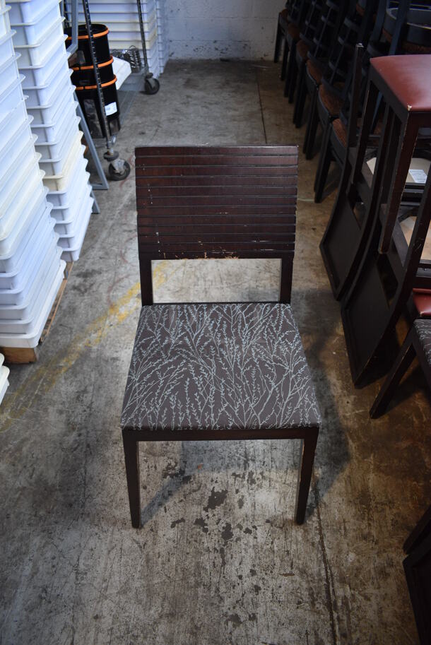 4 Wood Pattern Dining Chairs w/ Brown and Blue Patterned Cushion. Stock Picture - Cosmetic Condition May Vary. 18x18x35. 4 Times Your Bid!