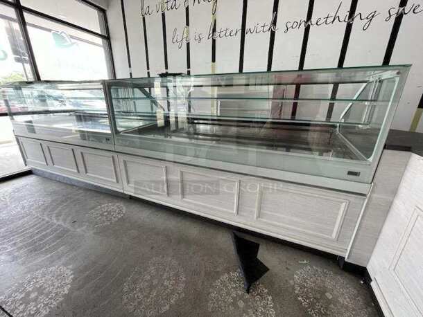 2019 IFI SAM80-PVAD-2125-AB Stainless Steel Commercial Floor Style Freezer Display Case Merchandiser. Picture of Unit Before Removal Is Used As Gallery Picture; See Subsequent Pictures For The Portion of the Display Case That This Lot Is. 208-220 Volts, 1 Phase. - Image 1 of 8