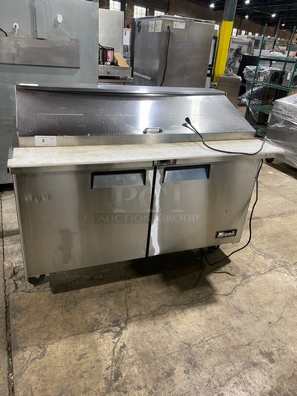 Migali Commercial Refrigerated Mega Top Sandwich Prep Table! With Commercial Cutting Board! With 2 Door Storage Space Underneath! Poly Coated Racks! All Stainless Steel! On Casters! Model: CSP6024BTHC SN: CSP6024BTHC00317060300920034 115V 60HZ 1 Phase