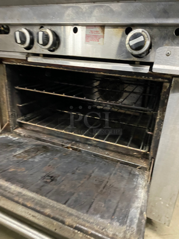 US Range Commercial Natural Gas Powered 2 Burner Stove With Flat Top Griddle! Griddle Has Side Splashes! With Raised Back Splash And Salamander! With Oven Underneath! All Stainless Steel! On Casters! - Image 8 of 11