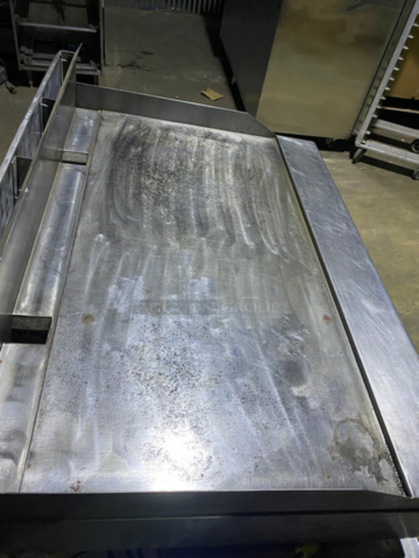 MUST HAVE! Garland Commercial Countertop Natural Gas Powered Heavy Duty Plancha Flat Grill! With Back And Side Splashes! On Heavy-Duty Stainless-Steel Equipment Stand! With Underneath Storage Space! On Casters! - Image 5 of 10