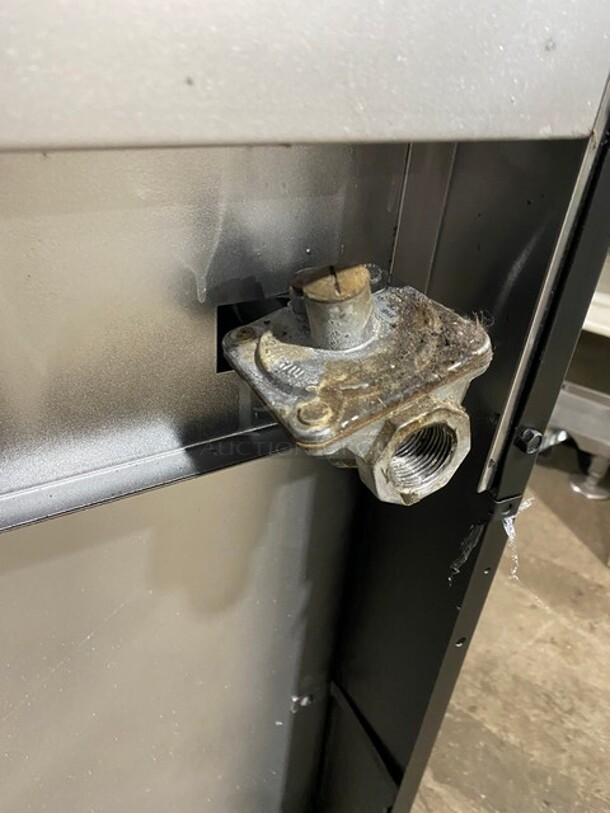 AMAZING! Garland Commercial Natural Gas Powered 6 Burner Split Top With Right Side Flat Griddle! With 2 Full Ovens Underneath! With Back Splash & Overhead Salamander Shelf! All Stainless Steel! With Metal Oven Racks! On Casters!  - Image 12 of 12