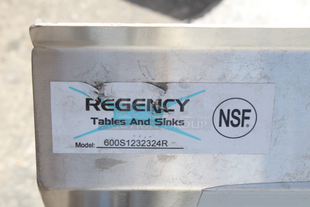 BRAND NEW SCRATCH & DENT! Regency 16 Gauge Stainless Steel One Compartment Commercial Sink and 1 Right Side Drainboard - 23" x 23" x 12" Bowl. Damaged where the legs connect, back right corner. see photos.  - Image 5 of 6
