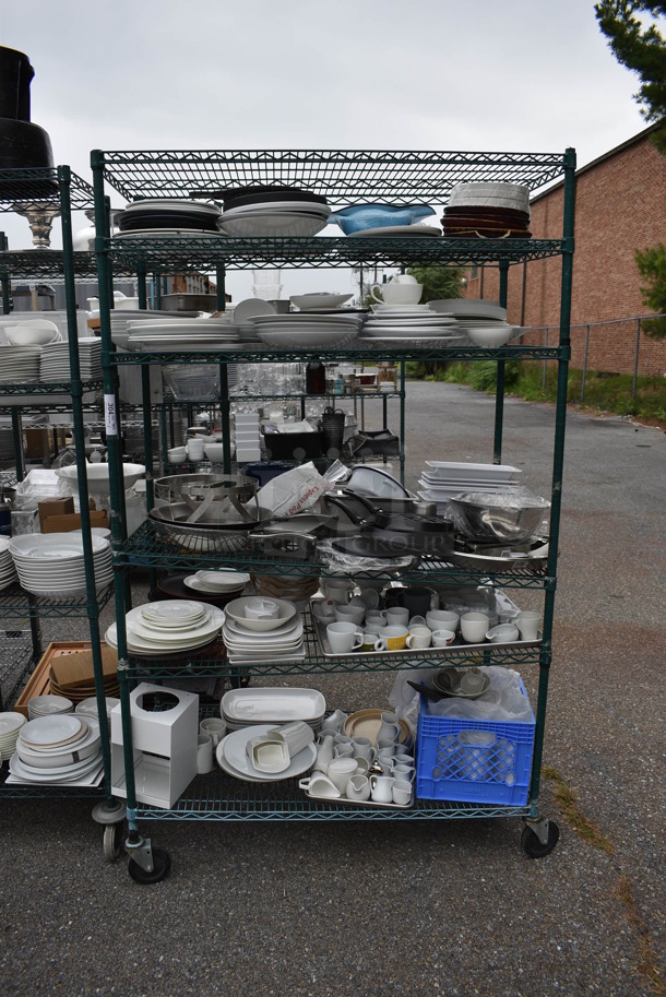 ALL ONE MONEY! Lot of 6 Tiers of Various Smallwares Including White Ceramic Plates, Mugs and Metal Bowls. Does Not Include Shelving Unit. 