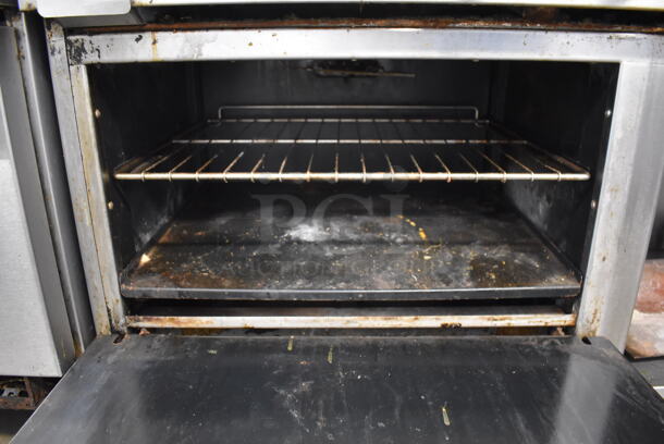 Imperial Stainless Steel Commercial Natural Gas Powered 4 Burner Range, Flat Top Griddle, Oven, Over Shelf and Back Splash on Commercial Casters. 60x31x57
 - Image 9 of 10
