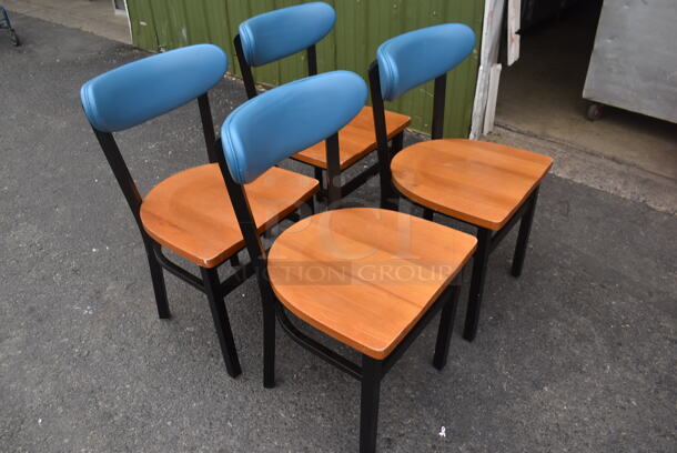 4 Chairs With Black Frame, Wood Style Seat And Blue Cushioned Stretcher. 4 Times Your Bid! Cosmetic Condition May Vary. - Image 2 of 3