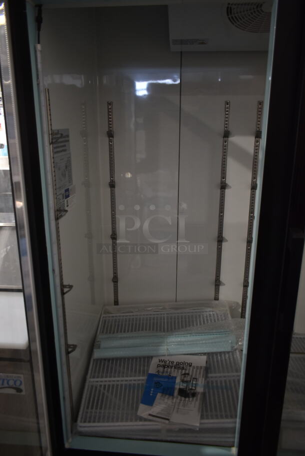 BRAND NEW SCRATCH AND DENT! 2023 Avantco 178GDC69HCB Metal Commercial 3 Door Reach In Cooler Merchandiser w/ Poly Coated Racks. 115 Volts, 1 Phase. Stock Picture Used as Gallery. Tested and Working! - Image 5 of 9