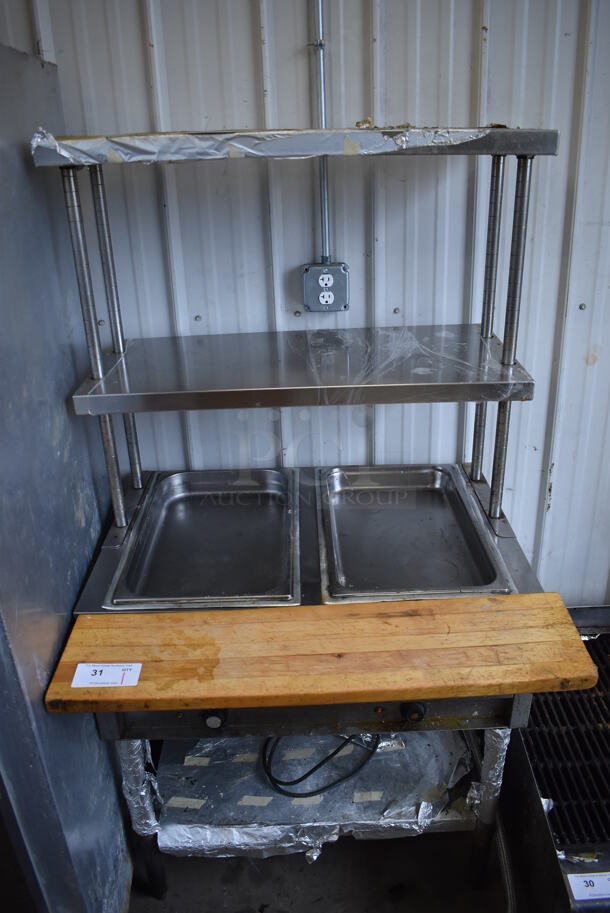 Stainless Steel Commercial 2 Well Steam Table w/ Butcher Block Cutting Board, 2 Tier Over Shelves and Under Shelf. 115 Volts, 1 Phase. 34x30.5x64. Tested and Does Not Power On