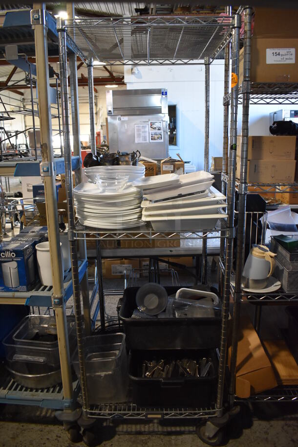 ALL ONE MONEY! Lot of Chrome Finish 3 Tier Shelving Unit on Commercial Casters w/ Contents Including Ceramic Dishes, Silverware and Poly Bins. BUYER MUST DISMANTLE. PCI CANNOT DISMANTLE FOR SHIPPING. PLEASE CONSIDER FREIGHT CHARGES. 24x24x68
