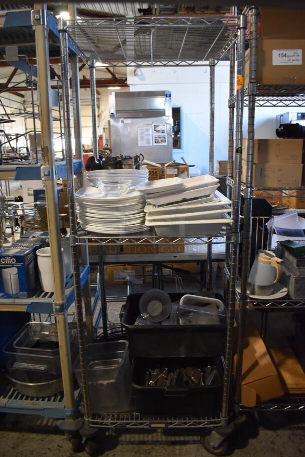 ALL ONE MONEY! Lot of Chrome Finish 3 Tier Shelving Unit on Commercial Casters w/ Contents Including Ceramic Dishes, Silverware and Poly Bins. BUYER MUST DISMANTLE. PCI CANNOT DISMANTLE FOR SHIPPING. PLEASE CONSIDER FREIGHT CHARGES. 24x24x68 - Image 1 of 11