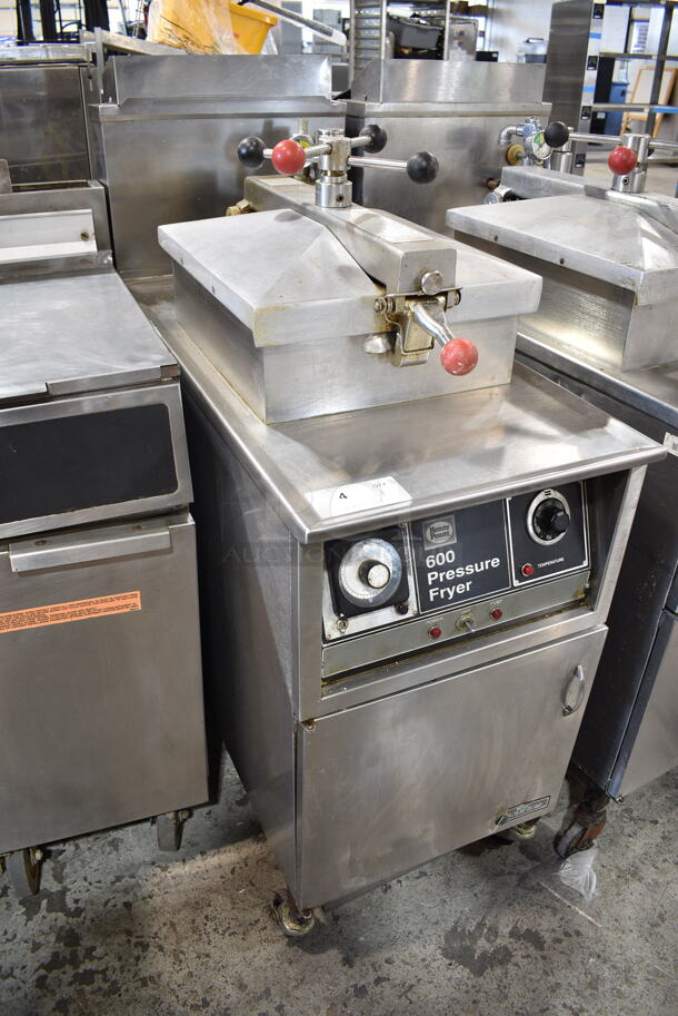 Henny Penny 600 Stainless Steel Commercial Floor Style Natural Gas Powered Pressure Fryer w/ Metal Fry Basket on Commercial Casters. 80,000 BTU.  - Image 2 of 10
