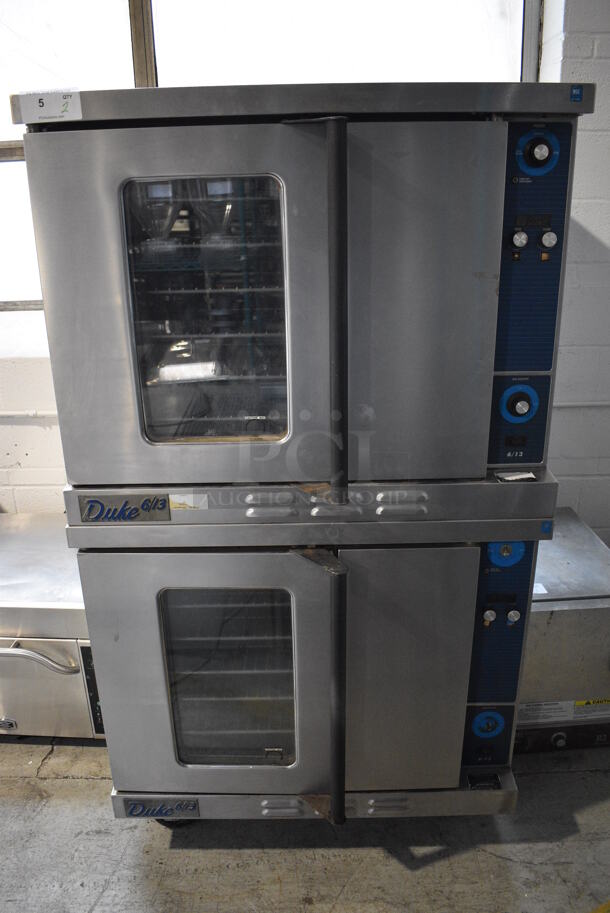 2 Duke Stainless Steel Commercial Natural Gas Powered Full Size Convection Ovens w/ View Through Door, Solid Door, Metal Oven Racks and Thermostatic Controls on Commercial Casters. 38x38x69. 2 Times Your Bid! - Image 1 of 9