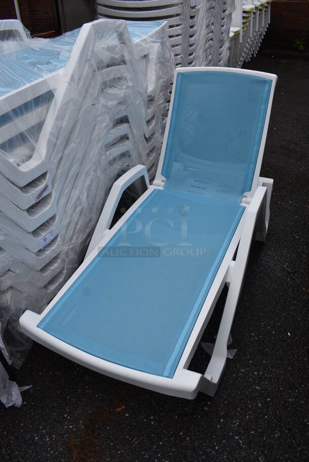 5 BRAND NEW SCRATCH AND DENT! Lancaster Table & Seating White Stacking Adjustable Chaise with Marine Blue Sling Seat. 72x28x19. 5 Times Your Bid!