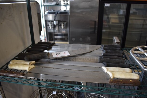 11 Various Knives; 10 Double Handle Cheese Knives. Includes 26x1x2.5. 11 Times Your Bid!