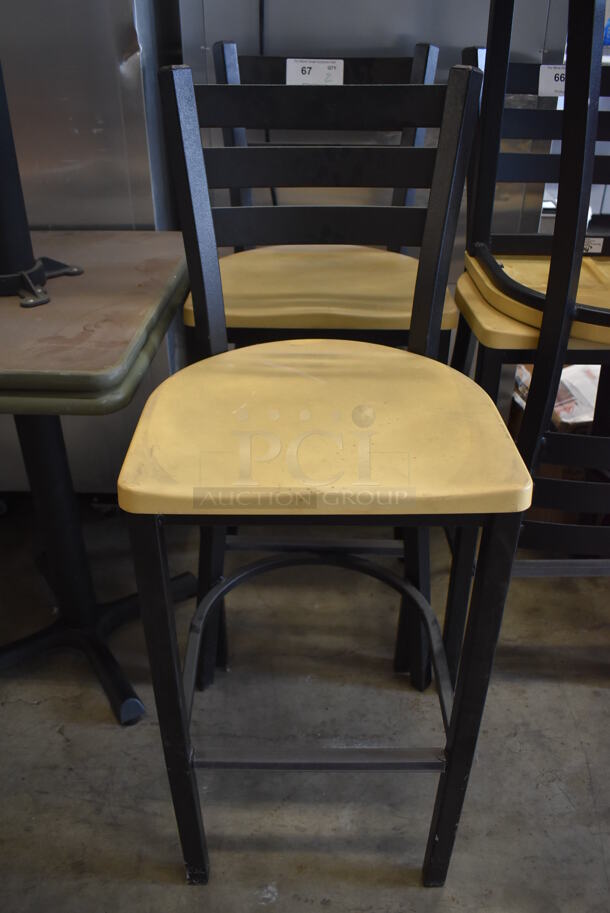 2 Black Metal Bar Height Chairs w/ Yellow Seats. 18.5x18x43.5. 2 Times Your Bid! - Image 1 of 4