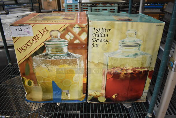 2 BRAND NEW IN BOX! Glass Beverage Jars. Includes 12x12x20. 2 Times Your Bid!