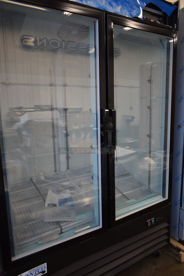 BRAND NEW SCRATCH AND DENT! 2023 Avantco 178GDC49FHCB Metal Commercial 2 Door Freezer Merchandiser w/ Poly Coated Racks on Commercial Casters. 115 Volts, 1 Phase. Tested and Working! - Image 4 of 12