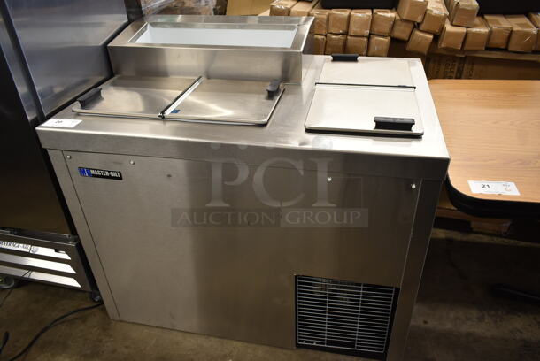 Master-Bilt FLR-60 SE Stainless Steel Commercial Freezer w/ 2 Center Hinge Lids and Topping Rail. 115 Volts, 1 Phase. Tested and Working!