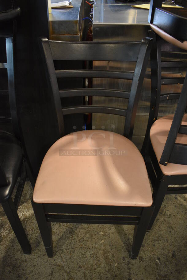 4 Wood Pattern Black Dining Chairs w/ Pink Seat Cushion. 17x17x34. 4 Times Your Bid! - Image 1 of 5