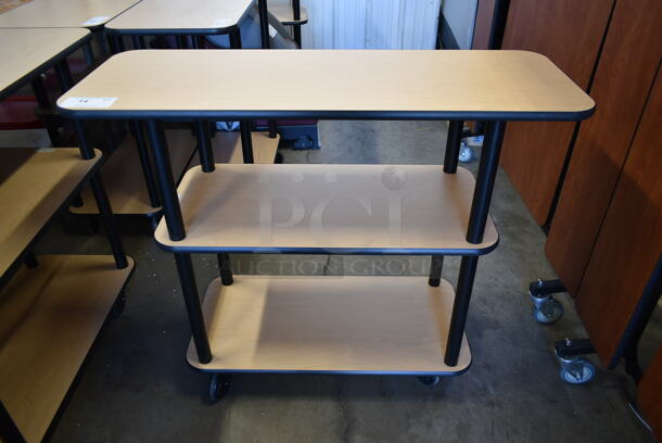 BRAND NEW SCRATCH AND DENT! Wood Pattern 3 Tier Cart / Table on Commercial Casters. Stock Picture - Cosmetic Condition May Vary.  - Image 1 of 6
