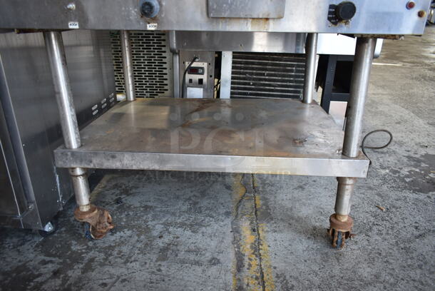 Lang G-3E Stainless Steel Commercial Natural Gas Powered Flat Top Griddle w/ Metal Under Shelf on Commercial Casters. 27,000 BTU.  - Image 4 of 5
