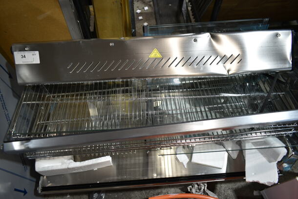 BRAND NEW SCRATCH AND DENT! ServIt 423HDM48SA Stainless Steel Commercial Countertop Full Service Heated Merchandiser Display Case. See Pictures for Damage. 120 Volts, 1 Phase. Tested and Working!
 - Image 3 of 7