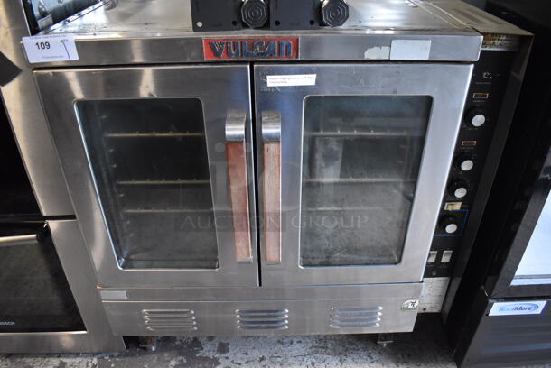 Vulcan SG22T Stainless Steel Commercial Propane Gas Powered Full Size Convection Oven w/ View Through Doors, Metal Oven Racks and Thermostatic Controls. Comes w/ 4 Legs. 
