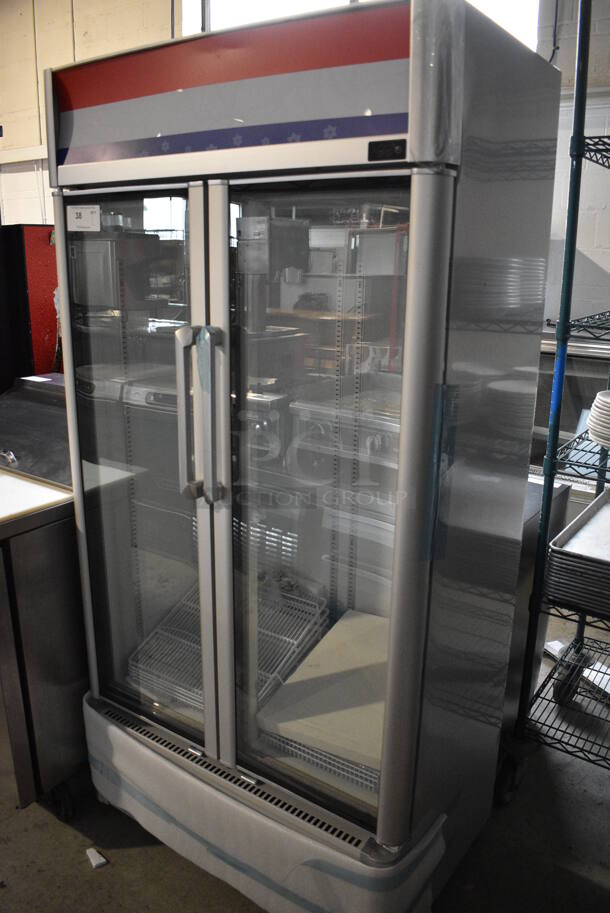BRAND NEW! Premium Levella Model PRN165DX Metal Commercial 2 Door Reach In Cooler Merchandiser w/ Poly Coated Racks. 115 Volts, 1 Phase. 35x23x73. Tested and Working! - Image 2 of 7