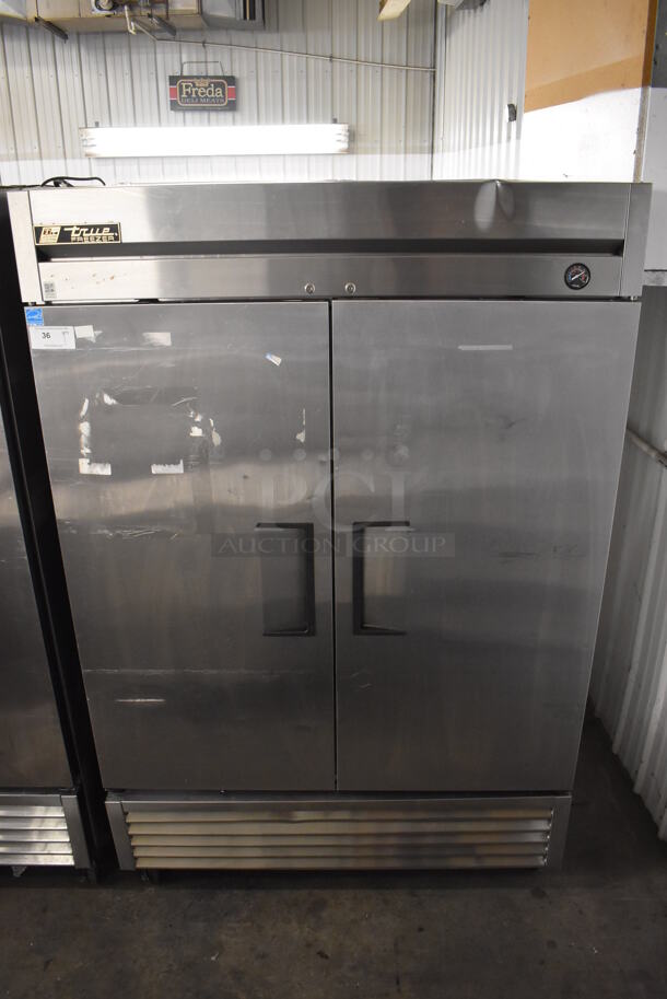 2013 True T-49F ENERGY STAR Stainless Steel Commercial 2 Door Reach In Freezer w/ Poly Coated Racks on Commercial Casters. 115 Volts, 1 Phase. 54x30x83. Tested and Working! - Image 1 of 7