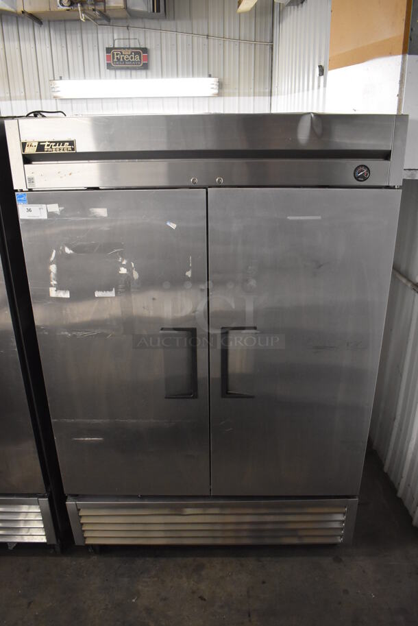 2013 True T-49F ENERGY STAR Stainless Steel Commercial 2 Door Reach In Freezer w/ Poly Coated Racks on Commercial Casters. 115 Volts, 1 Phase. 54x30x83. Tested and Working!