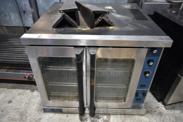Duke Stainless Steel Commercial Electric Powered Full Size Convection Full Size Convection Oven w/ View Through Doors, Metal Oven Racks, Thermostatic Controls and Metal Legs. 250 Volts, 3 Phase. 