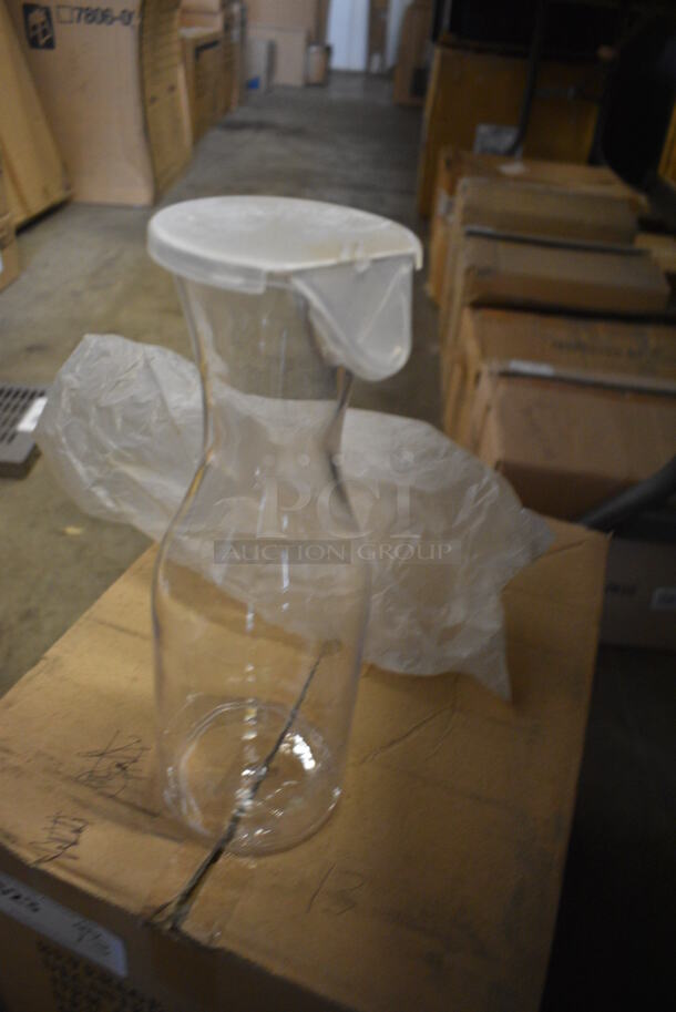 ALL ONE MONEY! Lot of 13 BRAND NEW IN BOX! Clear Poly Decanters w/ Lids. 4x4x11 - Image 2 of 3