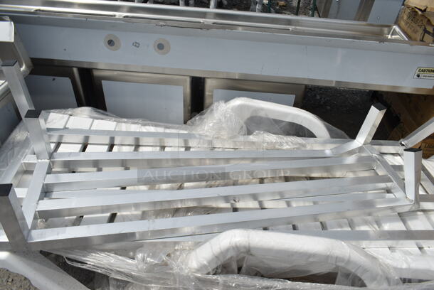 4 BRAND NEW SCRATCH AND DENT! Items; 1 White Resin Chaise Lounger and 3 Aluminum Dunnage Racks Including Regency 600DUN2036, Regency 600DUN1448, Regency 600DUN122060. See Pictures For Damage. 4 Times Your Bid! - Image 5 of 12