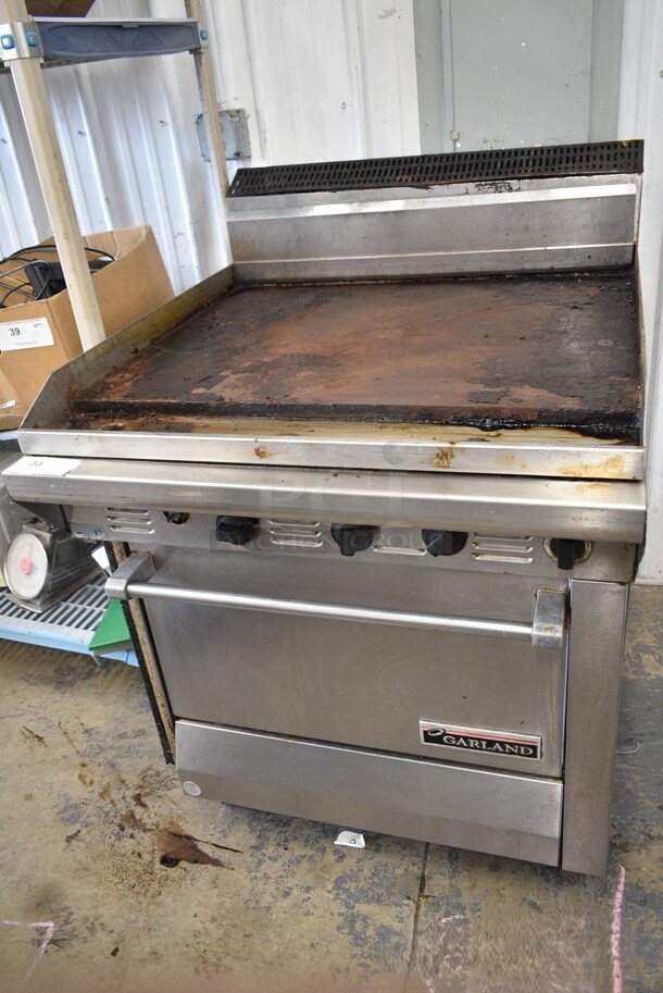 Garland Stainless Steel Commercial Natural Gas Powered Flat Top Griddle w/ Oven.  - Image 1 of 6