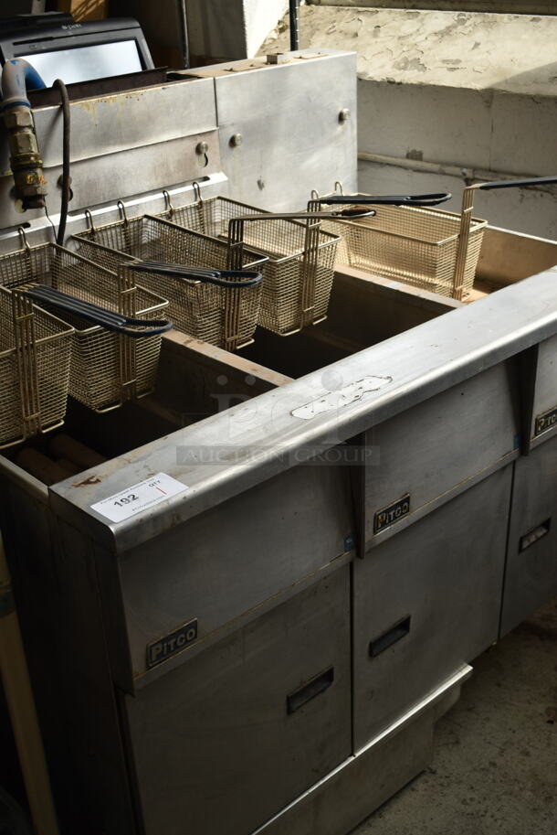 Pitco Frialator SG14-S Stainless Steel Commercial Natural Gas Powered 2 Bay Deep Fat Fryer w/ Dumping Station and 5 Metal Fry Baskets. 110,000 BTU. 