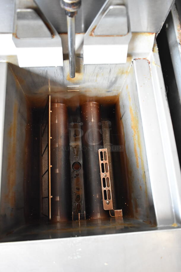 2016 Henny Penny OGA-323 ENERGY STAR Stainless Steel Commercial Natural Gas Powered 3 Bay Fryer w/ 4 Metal Fry Baskets on Commercial Casters. 255,000 BTU.  - Image 6 of 12