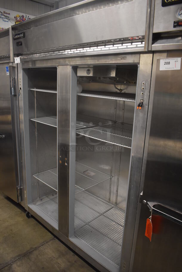 Continental 2FE ENERGY STAR Stainless Steel Commercial 2 Door Reach In Freezer on Commercial Casters. Missing Doors. 115 Volts, 1 Phase. 57x34x82. Tested and Does Not Power On