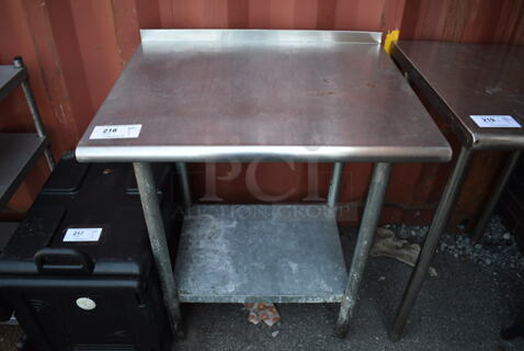 Stainless Steel Table w/ Metal Under Shelf and Back Splash. 30x24x37