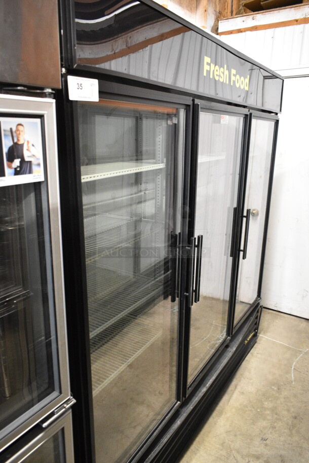 2014 True GDM-72-LD ENERGY STAR Metal Commercial 3 Door Reach In Cooler Merchandiser w/ Poly Coated Racks. 115 Volts, 1 Phase. Tested and Working! - Image 1 of 6