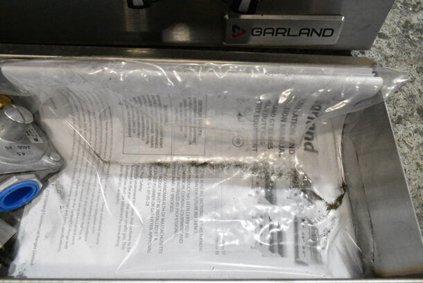 BRAND NEW SCRATCH AND DENT! 2024 Garland GTGG24-GT24M 24" Natural Gas Countertop Griddle with Thermostatic Controls.  - Image 7 of 10