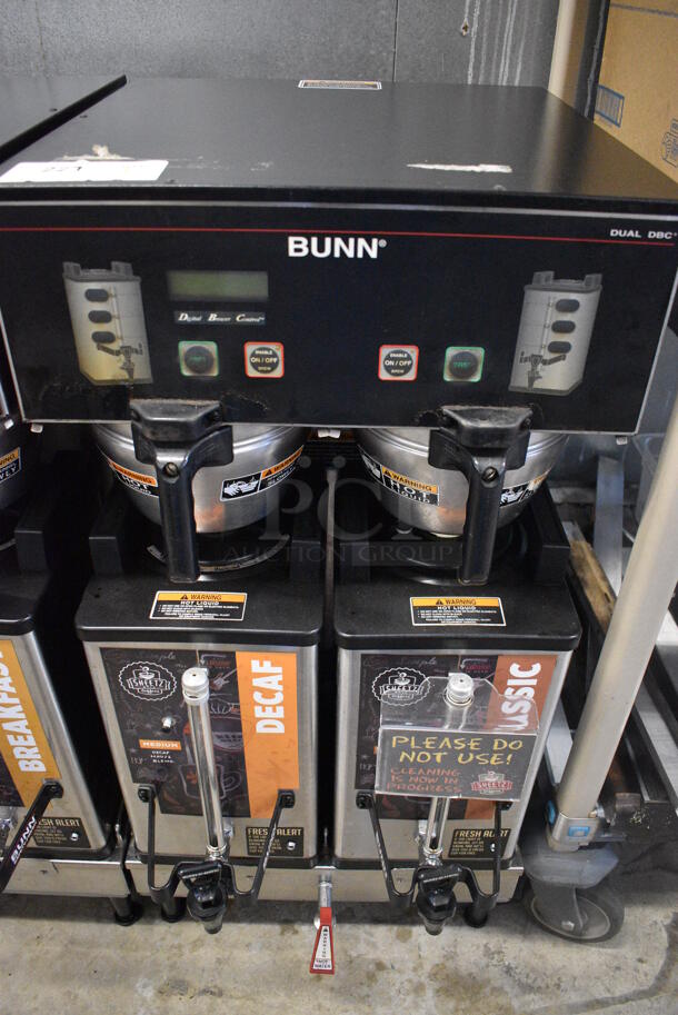 2012 Bunn Model DUAL SH DBC Stainless Steel Commercial Countertop Dual Coffee Machine w/ Hot Water Dispenser, 2 Stainless Steel Brew Baskets and 2 Bunn Model SH SERVER Satellite Servers. 120/208-240 Volts, 1 Phase. 18x24x36. Tested and Working! - Image 1 of 5