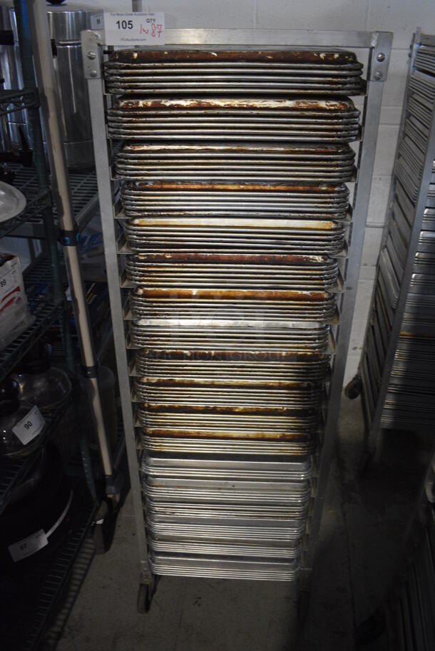 Metal Commercial Pan Transport Rack on Commercial Casters w/ 87 Metal Full Size Baking Pans. 20.5x26.5x63. Pans 18x26x1