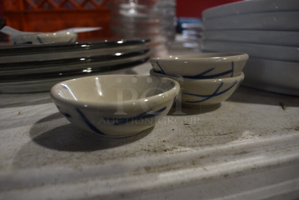 4 White and Blue Ceramic Bowls. 2.5x2.5x1. 4 Times Your Bid!