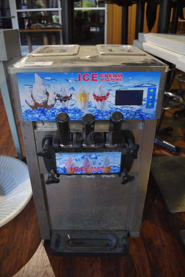 ZM-168 Stainless Steel Commercial Countertop Air Cooled 2 Flavor w/ Twist Soft Serve Ice Cream. 110 Volts, 1 Phase. 17x25x30. Item Was in Working Condition on Last Day of Business. (lounge)