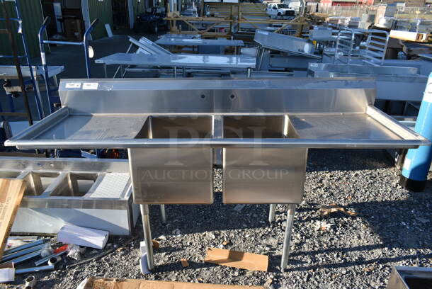 BRAND NEW SCRATCH AND DENT! Regency 600S21824224 Stainless Steel Commercial 2 Bay Sink w/ Dual Drain Boards. Bays 18x24. Drain Boards 22.5x26