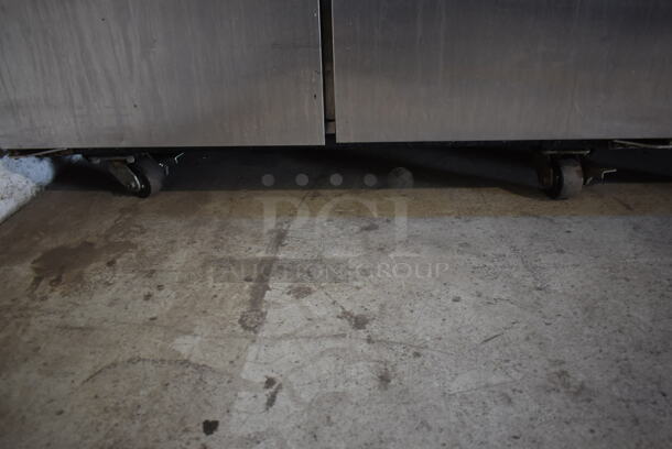 2013 True TG2R-2S ENERGY STAR Stainless Steel Commercial 2 Door Reach In Cooler w/ Poly Coated Racks on Commercial Casters. 115 Volts, 1 Phase. Tested and Working! - Image 4 of 8