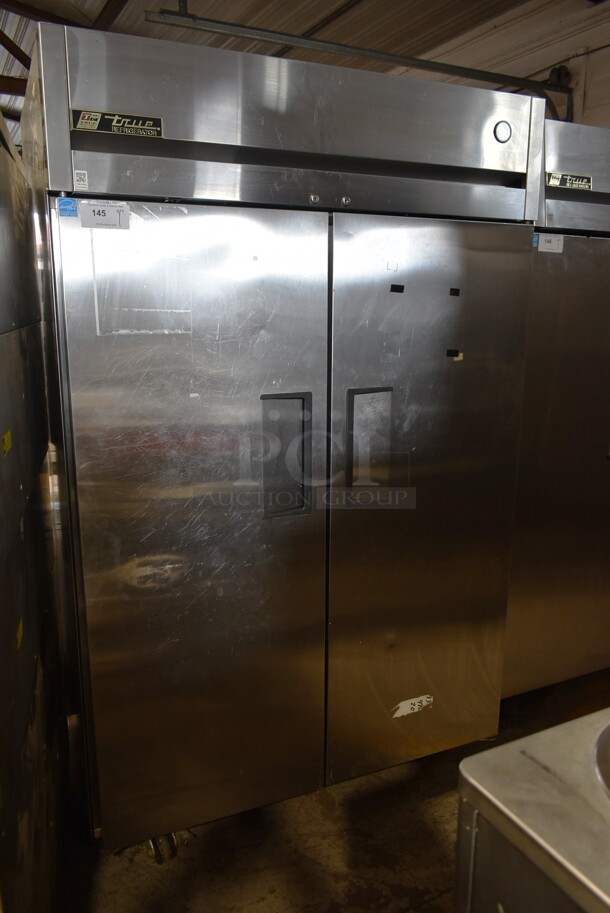 2012 True TG2R-2S ENERGY STAR Stainless Steel Commercial 2 Door Reach In Cooler w/ Poly Coated Racks on Commercial Casters. 115 Volts, 1 Phase. Tested and Working! - Image 1 of 7