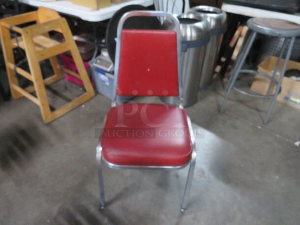 Metal Stack Chair With Red Cushioned Seat. 2XBID - Image 1 of 1