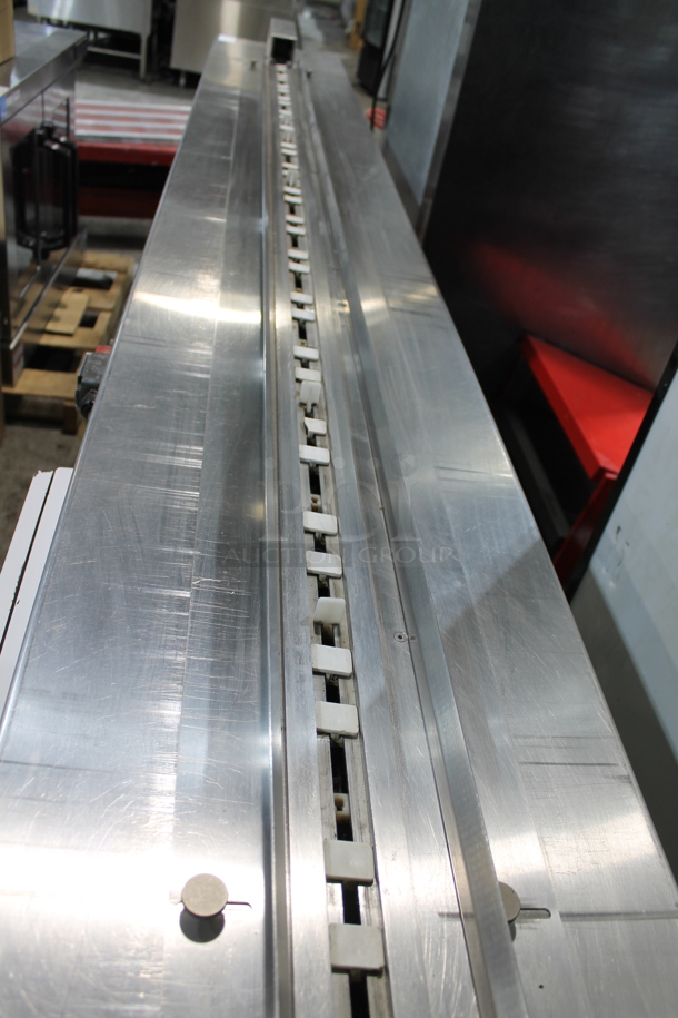 PFM Packaging 30 M Metal Commercial Floor Style Horizontal Form Fill and Seal / Horizontal Flow Wrapper Machine on Commercial Casters. 220 Volts, 1 Phase.  - Image 10 of 11