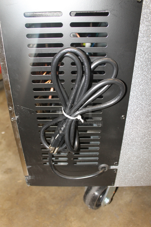 BRAND NEW SCRATCH AND DENT! Avantco 178CBE72HC Commercial Stainless Steel Electric 4-Door Refrigerated Chef Base On Commercial Casters.  115 Volts, 1 Phase. Tested and Working! - Image 8 of 11